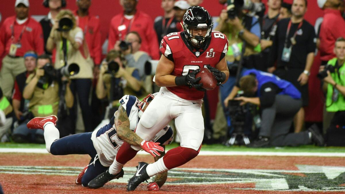 Austin Hooper of the Atlanta Falcons catches a 19 yard touchdown against Patrick Chung of the New England Patriots in the second quarter.
