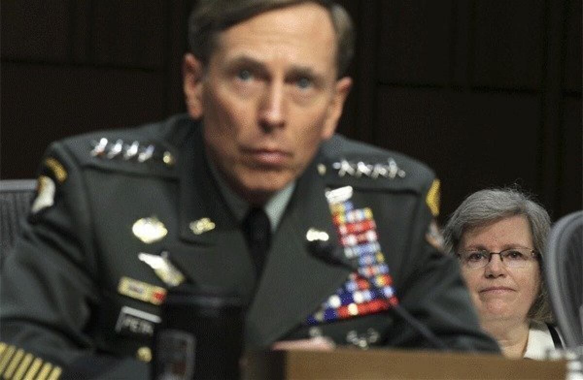 David Petraeus submitted his resignation as director of the CIA on Nov. 9 citing an extramarital affair. Above: Petraeus is seen during a confirmation hearing before the Senate on June 23, 2011 as his wife Holly Petraeus, looks on.