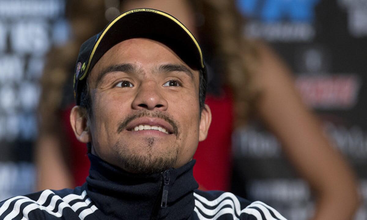 Boxer Juan Manuel Marquez takes part in a news conference promoting his fight against Timothy Bradley in October. Marquez says he is anticipating "a difficult fight" against Mike Alvarado in May.