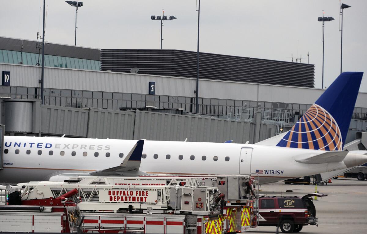 Emergency vehicles surround a SkyWest Airlines plane, operating as United Express, that made an emergency landing at Buffalo Niagara International Airport on Wednesday.