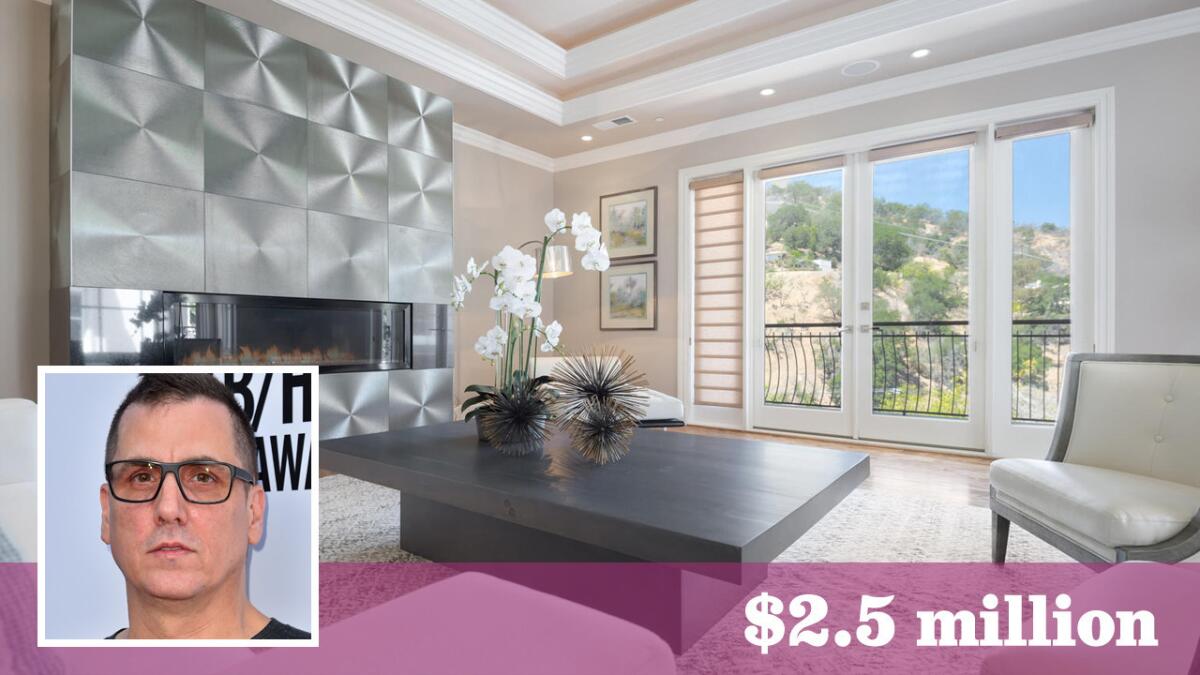 Hip-hop producer Mike Dean has paid $2.5 million for the Studio City home of Canadian comic Russell Peters.