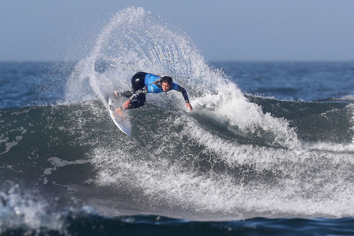 U.S. surfer Caroline Marks competes during the U.S. Open of Surfing at Huntington Beach Pier on Saturday.