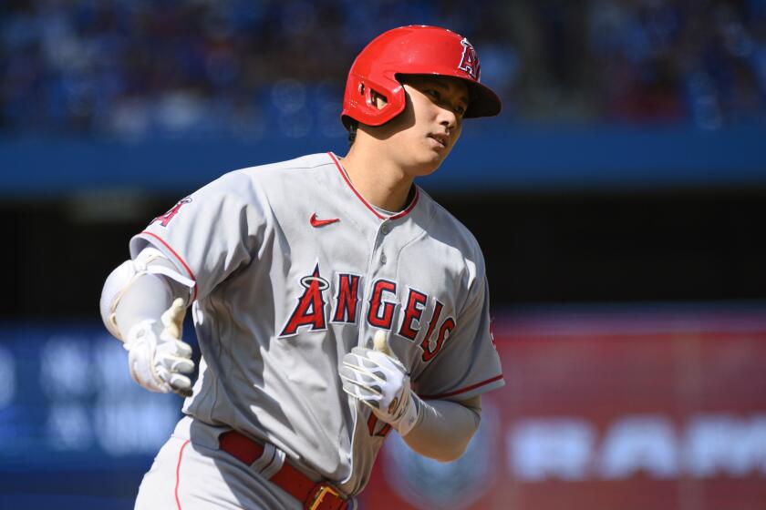 Los Angeles Angels designated hitter Shohei Ohtani (17) rounds the bases after hitting a two-run home run.