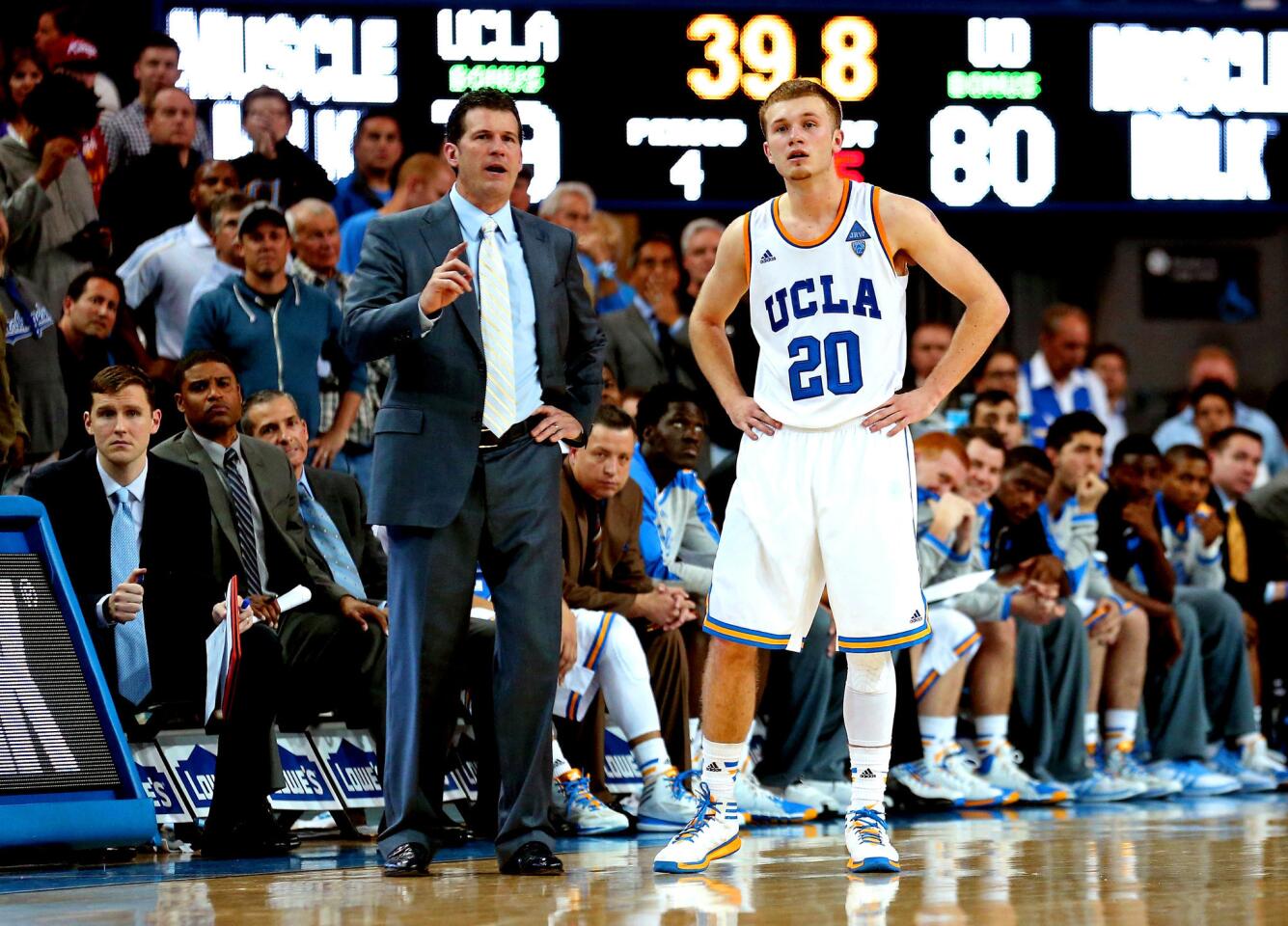 UCLA Coach Steve Alford and son Bryce confer during a game against Oregon at Pauley Pavilion on Feb. 27.