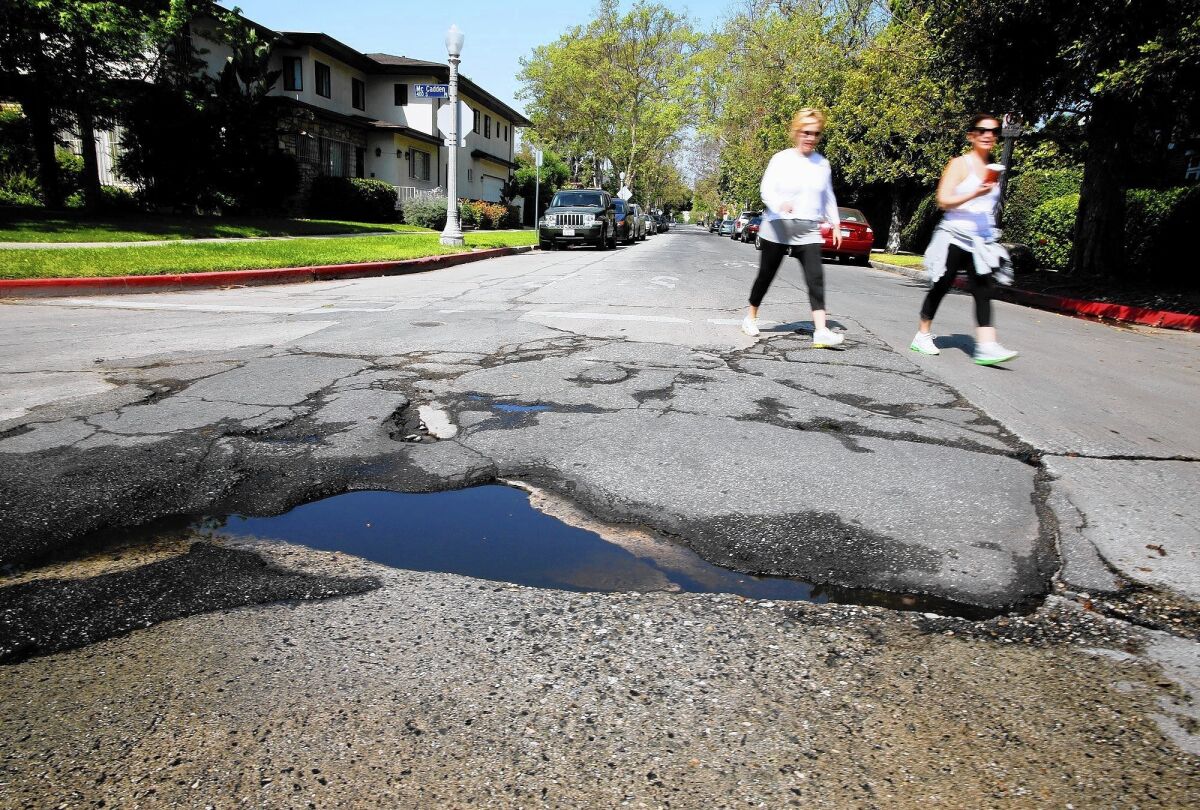 A pothole in need of repair in Hancock Park. Los Angeles is among the U.S. cities that have raised their sales taxes to pay for transportation needs.