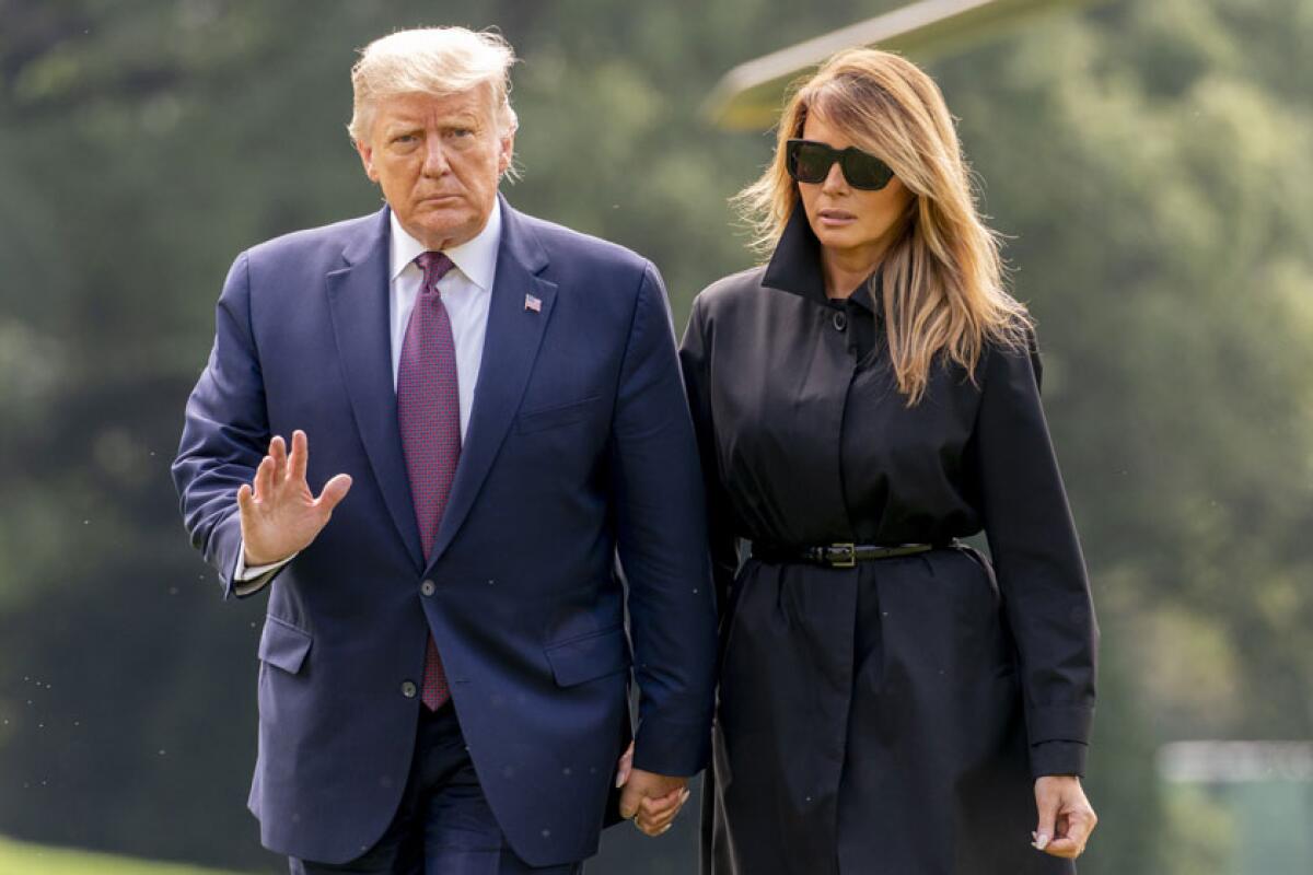 President Trump and First Lady Melania Trump arrive at the White House on Sept. 11.
