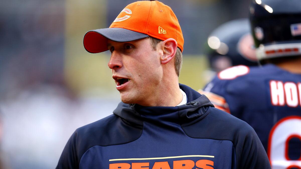 Adam Gase watches the Bears warm up before their final game of the season against Detroit on Jan. 3.