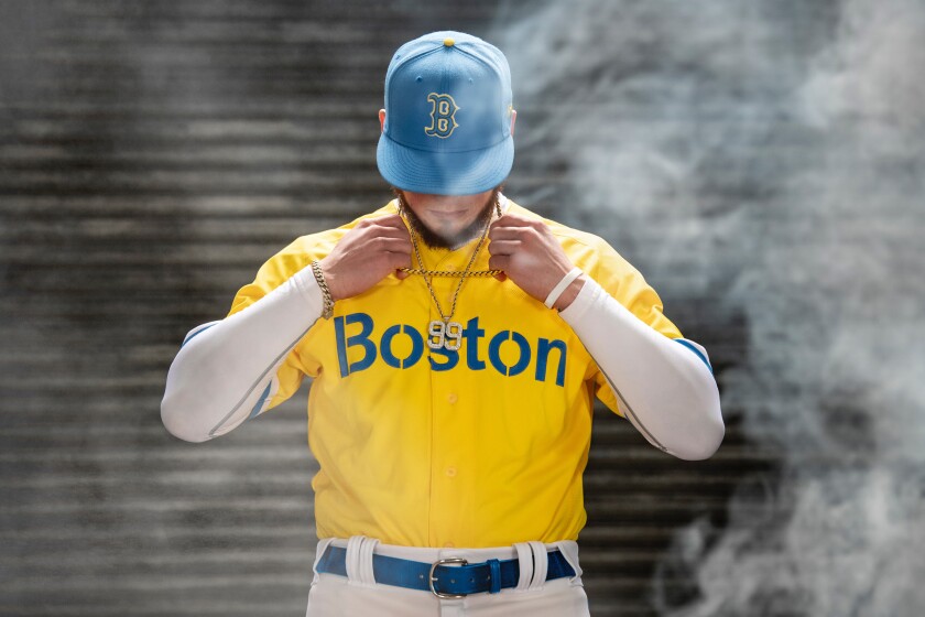 Boston Red Sox outfielder Alex Verdugo poses in the team's City Connect uniform.
