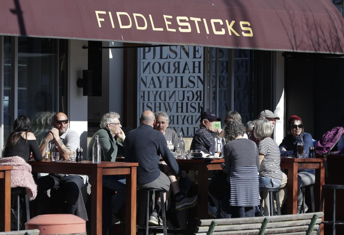 Customers at a cafe in Christchurch, New Zealand