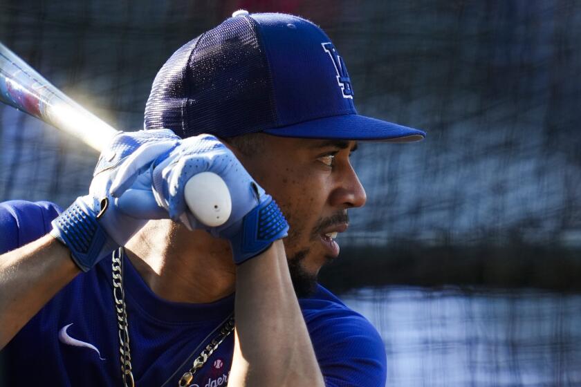 Los Angeles Dodgers right fielder Mookie Betts (50) participates in batting practice.