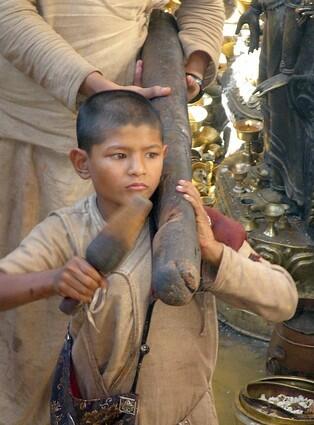 A young Buddhist monk learns at the Golden Temple in Patan, an old city now melded together in urban sprawl with Katmandu and Bhaktapur.