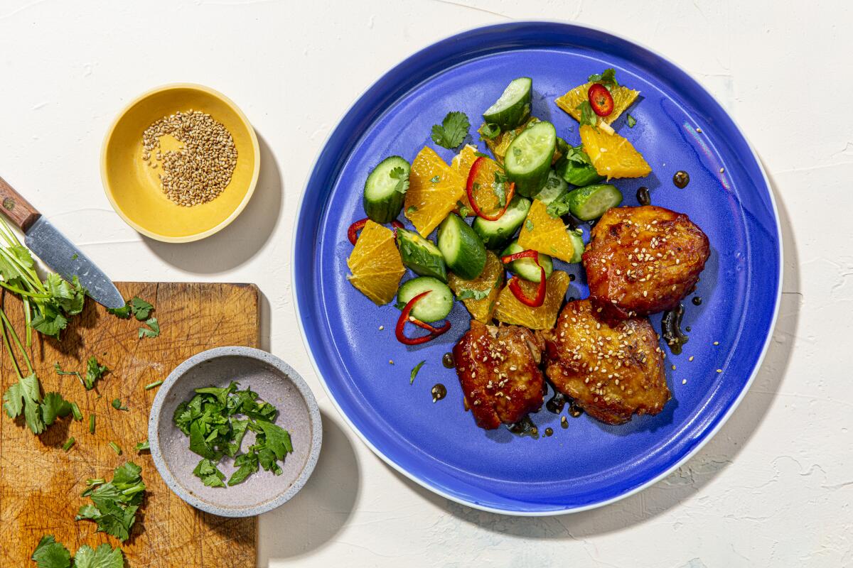 Sticky orange chicken thighs with cucumber salad for Ben Mims's first "Week of Meals" series. 