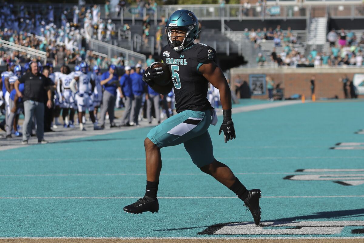 Coastal Carolina running back Shermari Jones (5) walks into the end zone for a 2-yard touchdown against Georgia State during the first half of an NCAA college football game Saturday, Nov. 13, 2021, in Conway, S.C. (AP Photo/Artie Walker, Jr.)