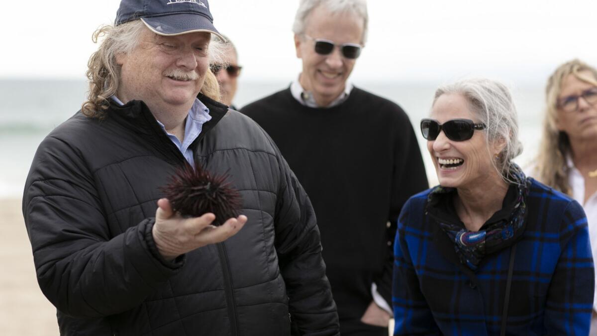 Jonathan Gold handles a sea urchin during the Food Bowl in May. He wasn't an environmentalist, his brother says. But he still made an impact.