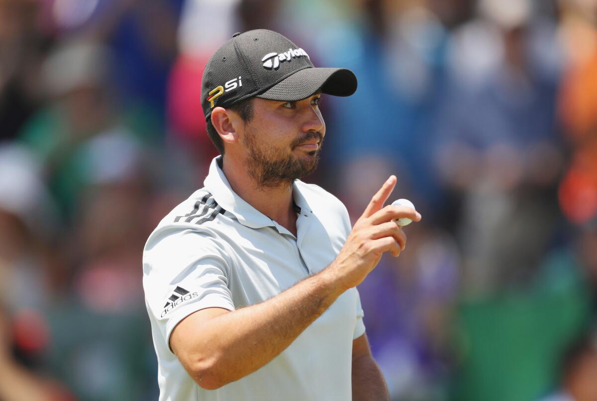 Jason Day acknowledges the fans at the ninth green during the first round of the Players Championships on Thursday, when he would tie the course record with a 63.