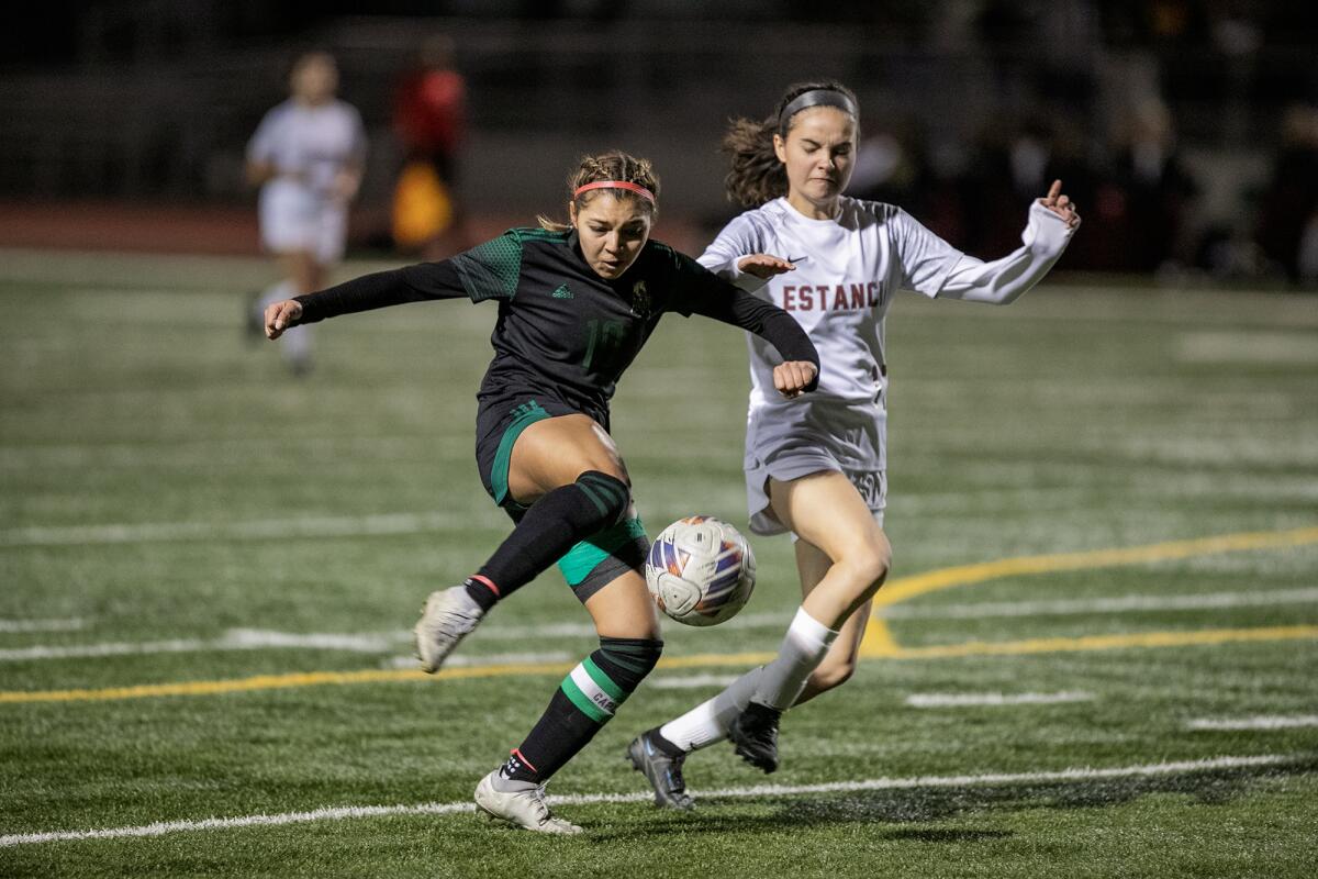 Costa Mesa's Itzel Ramirez shoots and scores during Tuesday's Orange Coast League match.