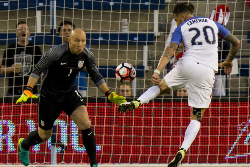 USA's Geoff Cameron, right, knocks the ball away from Brad Guzan after a Bolivia player deflected the ball in the second half of the COPA America Centenario USA 2016 on Saturday.