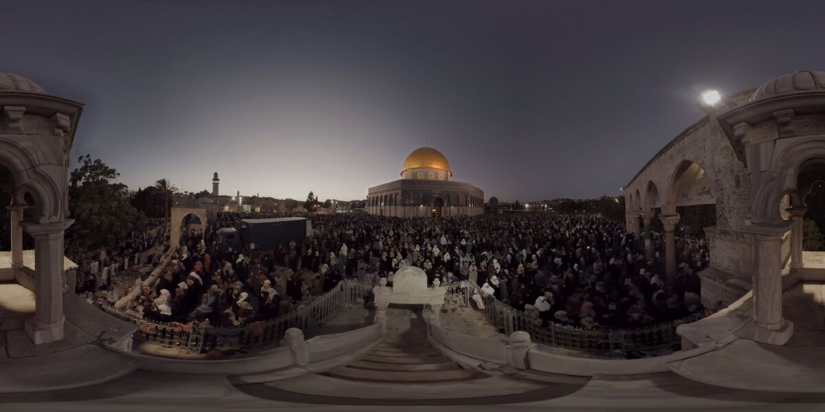 This July 22, 2019, photo taken from video gives a 360-degree view of Ramadan prayers on the plateau of the Dome of the Rock, which can be seen in The Holy City, a virtual reality experience in the metaverse. (The Holy City VR via AP)