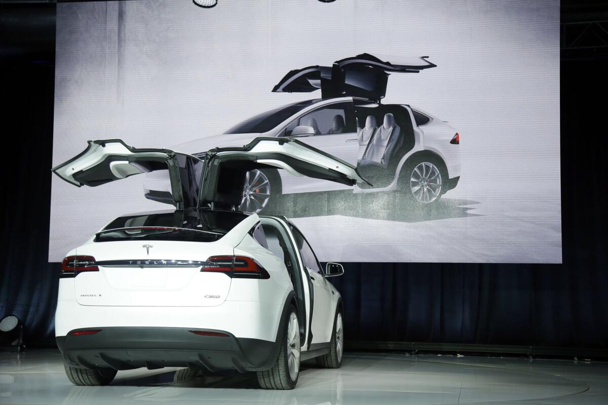 The Tesla Model X crossover, list price unknown, is unveiled Tuesday in Fremont, Calif.