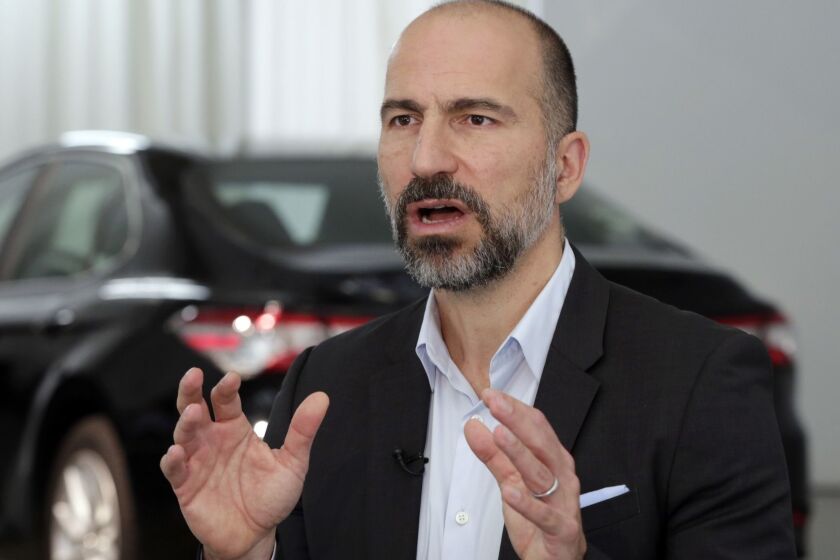 FILE- In this Sept. 5, 2018, file photo Uber CEO Dara Khosrowshahi is interviewed after the company's unveiling of the new features, in New York. Uber's net loss widened by $177 million in the third quarter as the ride-hailing giant continued to invest ahead of a planned public stock offering next year. (AP Photo/Richard Drew, File)