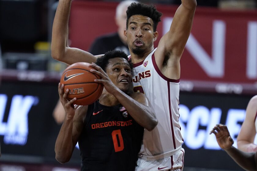 Oregon State guard Gianni Hunt (0) shoots against Southern California forward Isaiah Mobley, right, during the first half of an NCAA college basketball game Thursday, Jan. 28, 2021, in Los Angeles. (AP Photo/Ashley Landis)