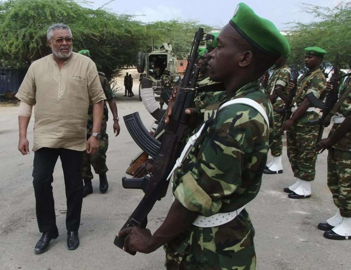 Jerry Rawlings inspects troops in 2011.