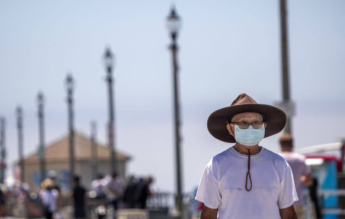 A man wears a mask in Huntington Beach.