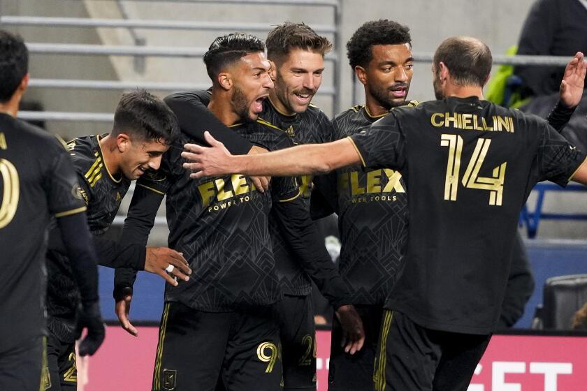 LAFC forward Denis Bouanga celebrates with teammates after scoring during a conference semifinal victory.