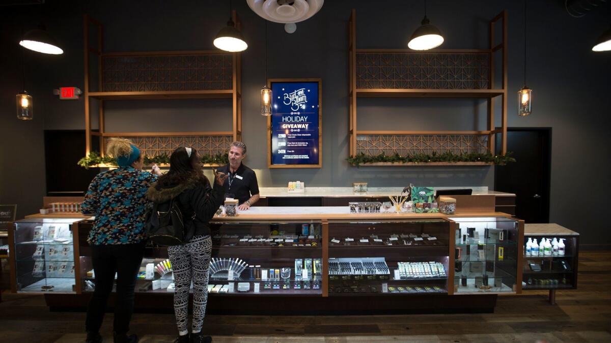 Patrons shop at Bud and Bloom, a Santa Ana marijuana dispensary.