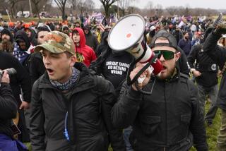 FILE - Proud Boys members Zachary Rehl, left, and Ethan Nordean, walk toward the U.S. Capitol in Washington, in support of President Donald Trump, Jan. 6, 2021. Federal prosecutors disclosed Wednesday, March 22, 2023, that a witness expected to testify for the defense at the seditious conspiracy trial of former Proud Boys leader Enrique Tarrio and four associates was secretly acting as a government informant for nearly two years after the Jan. 6 attack on the U.S. Capitol, a defense lawyer said in a court filing. Carmen Hernandez, a lawyer for Rehl, asked a judge to schedule an immediate emergency hearing and suspend the trial “until these issues have been considered and resolved.” (AP Photo/Carolyn Kaster, File)