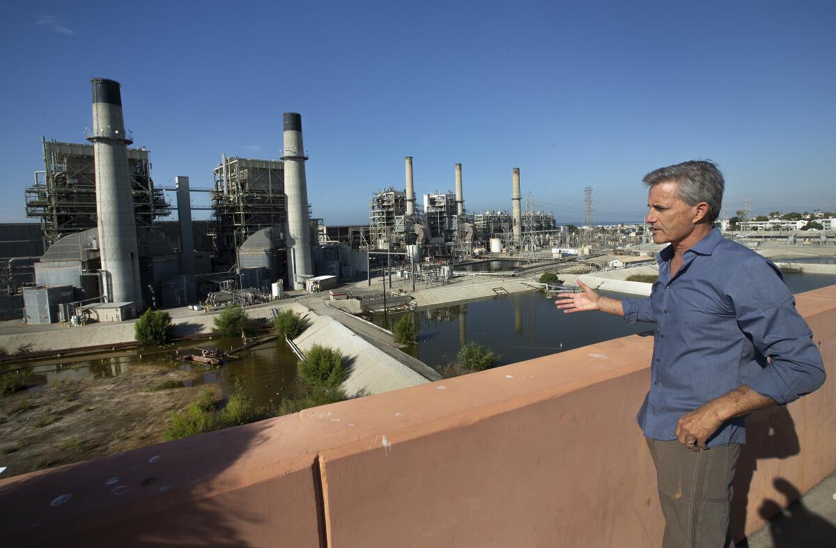 Redondo Beach Mayor Bill Brand is photographed next to the AES Power Plant in Redondo Beach in 2019.