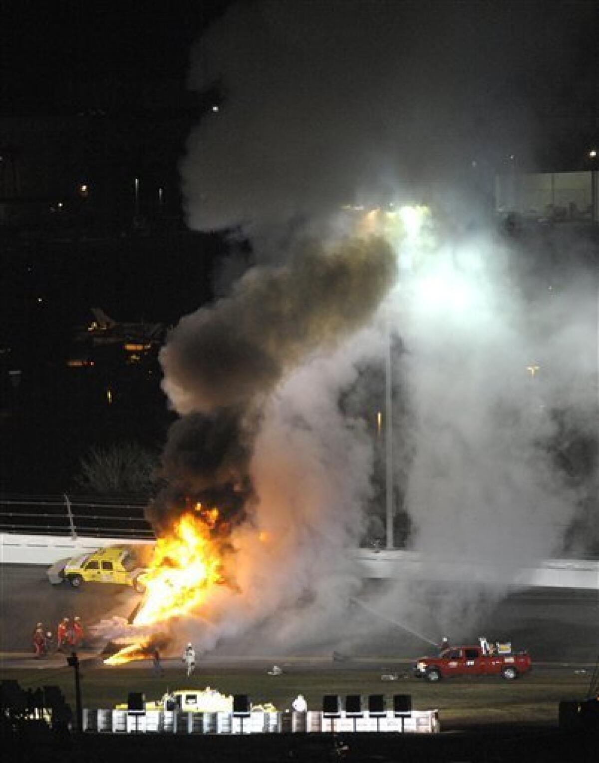 Flames shoot up from burning fuel from a jet dryer after Juan Pablo Montoya's car collided with the dryer during a caution in the NASCAR Daytona 500 auto race at Daytona International Speedway in Daytona Beach, Fla., Monday, Feb. 27, 2012. (AP Photo/Phelan M. Ebenhack)