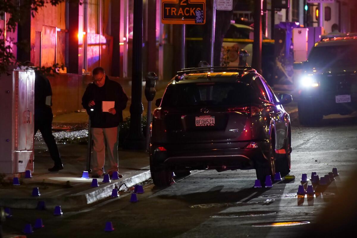 Investigators search for evidence in the area of a mass shooting In Sacramento, Calif. April 3, 2022.