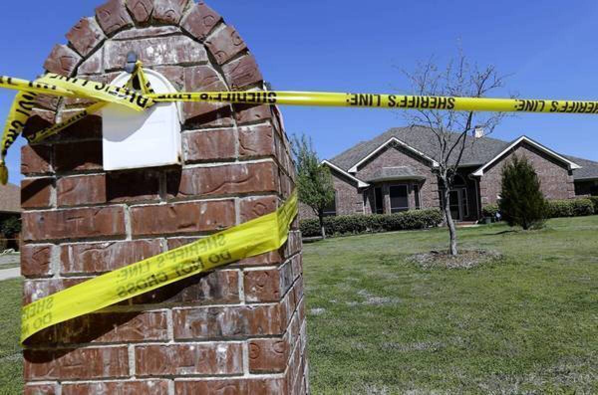 The home of Kaufman County Dist. Atty. Mike McLelland and his wife, Cynthia, was marked off as a crime scene after the couple were slain there.
