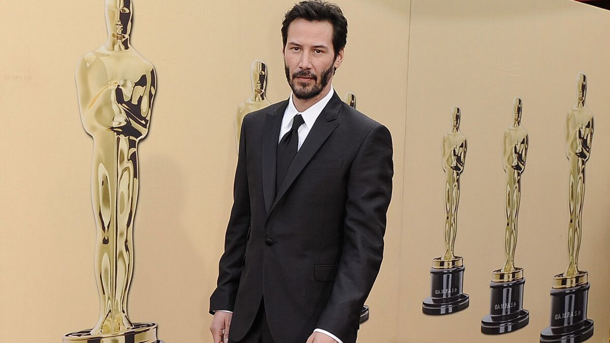Keanu Reeves called police after discovering a female intruder in his Hollywood Hills home.