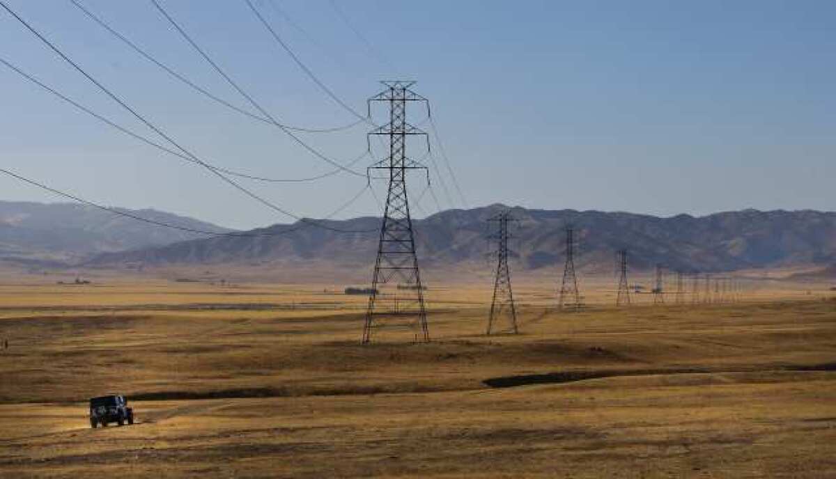 Electric transmission lines run through the rural Panoche Valley in California's San Benito County.