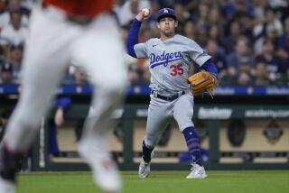 Dodgers starting pitcher Gavin Stone throws out Houston Astros designated hitter Yordan Alvarez on a ground ball
