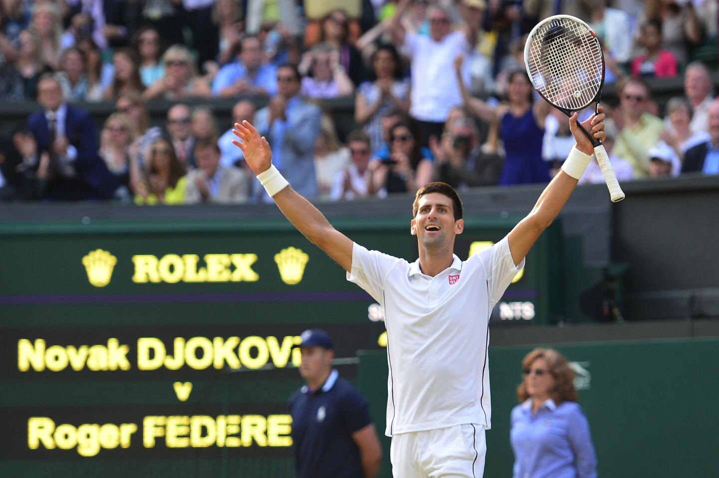 Novak Djokovic celebrates after defeating Roger Federer in five sets in the men's championship match at Wimbledon on Sunday. It was Djokovic's second Wimbledon title.