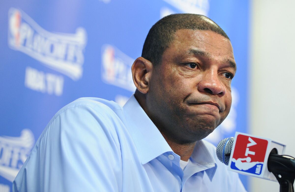 Clippers coach Doc Rivers speaks at a press conference.
