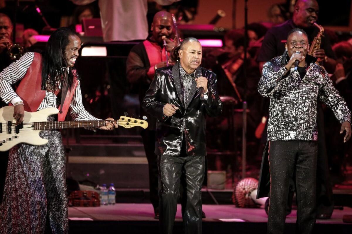 From left, Verdine White, Ralph Johnson and Philip Bailey of Earth, Wind and Fire perform with the Hollywood Bowl Orchestra at the Hollywood Bowl.
