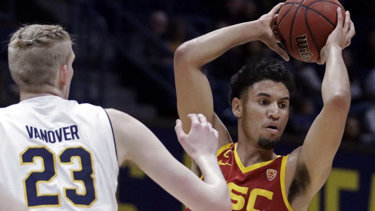 USC's Bennie Boatwright looks to pass the ball against California's Connor Vanover (23) in the first half on Feb. 16 in Berkeley.