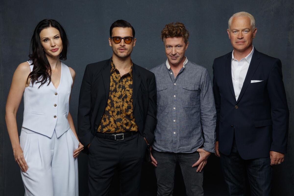 Laura Mennell, from left, Michael Malarkey, Aidan Gillen and Neal McDonough from the television series "Project Blue Book."