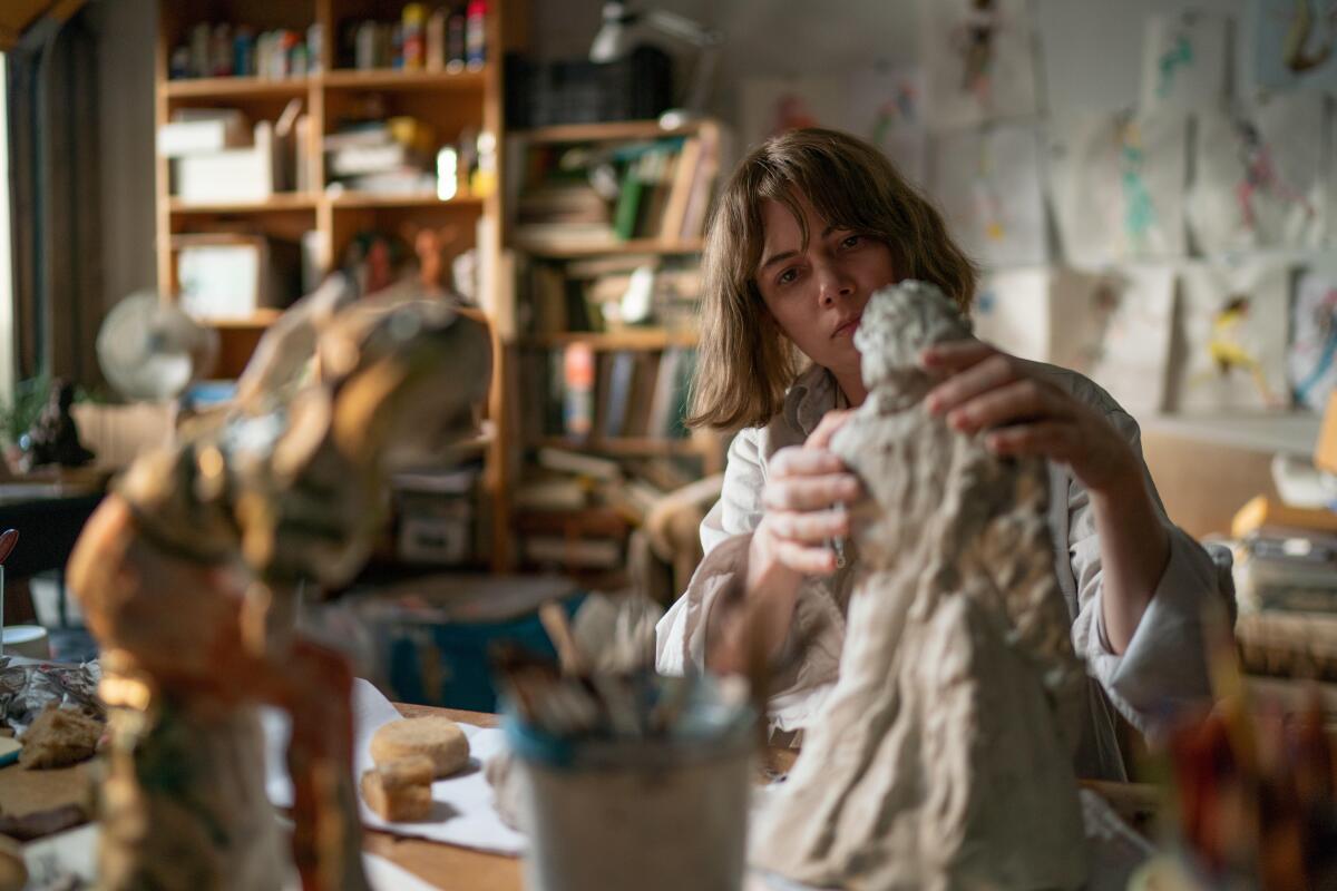 A sculptor in her studio.