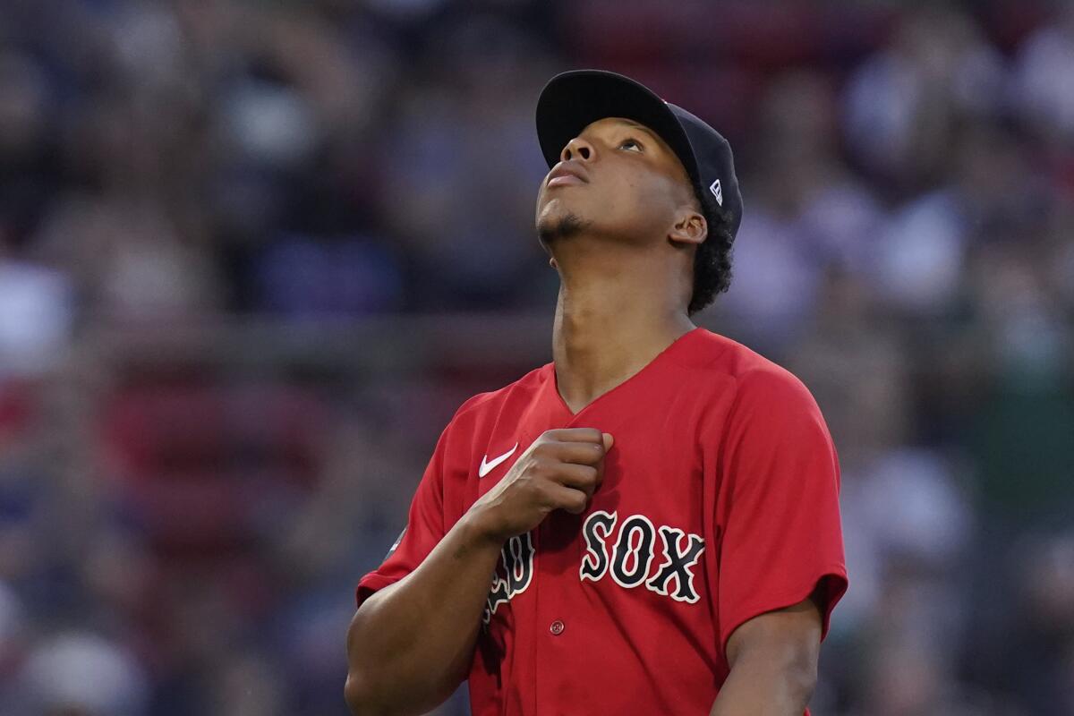 Rockies take down Red Sox in extra innings, again, for third