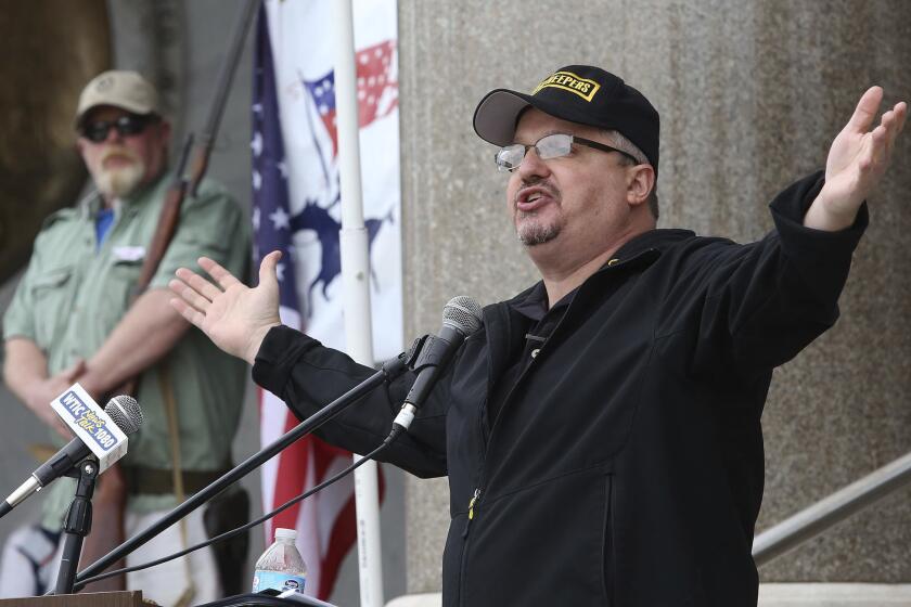 FILE - Stewart Rhodes, founder and president of the pro gun rights organization Oath Keepers speaks during a gun rights rally at the Connecticut State Capitol in Hartford, Conn., Saturday April 20, 2013. Rhodes has been arrested and charged with seditious conspiracy in the Jan. 6 attack on the U.S. Capitol. The Justice Department announced the charges against Rhodes on Thursday. (AP Photo/Journal Inquirer, Jared Ramsdell, File) MANDATORY CREDIT