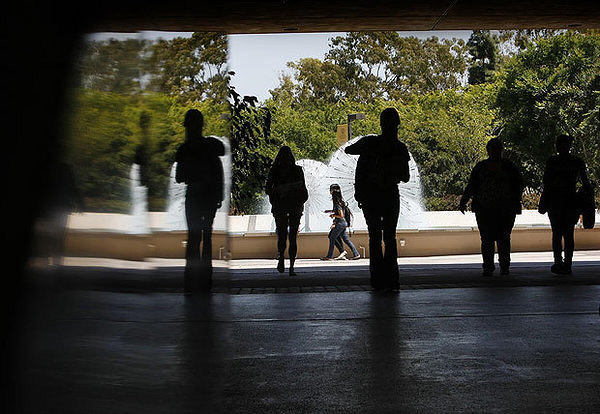 Students walk between Lough Memorial Fountain and Brotman Hall at Cal State Long Beach.