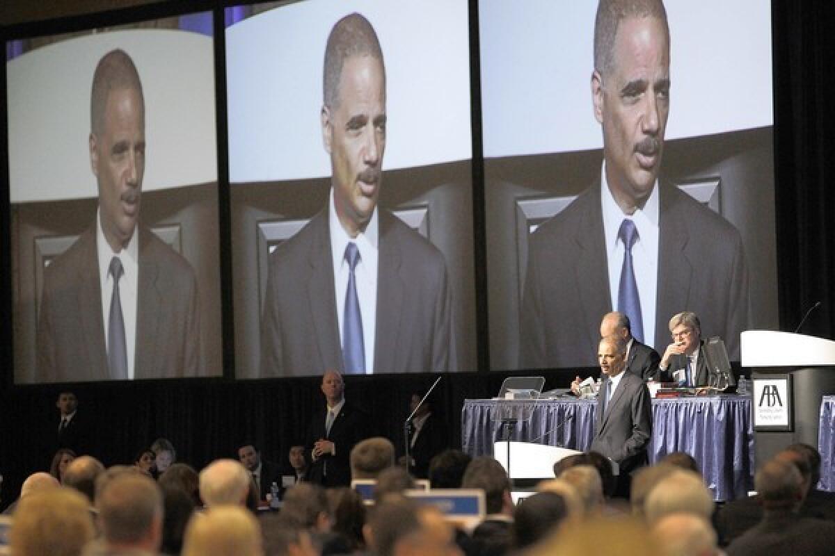 U.S. Atty. Gen. Eric Holder speaks at the American Bar Assn's annual meeting in San Francisco Annual meeting at Moscone West in San Francisco on Monday, where he said the Obama administration would cut back harsh sentences for low-level drug offenders and divert crime-fighting dollars elsewhere.