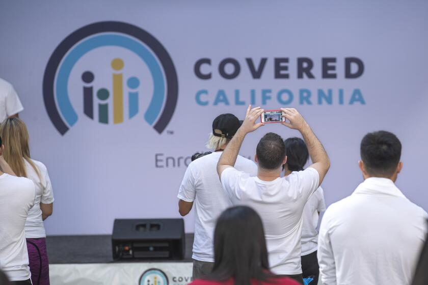 LOS ANGELES, CA-NOVEMBER 4, 2019: A banner promoting Covered California is displayed during a Covered California Open Enrollment Kickoff Event at The Bloc in downtown Los Angeles. The event was held to help raise awareness among Angelenos that part of living a healthy and active lifestyle is to have affordable, quality health coverage. (Mel Melcon/Los Angeles Times)