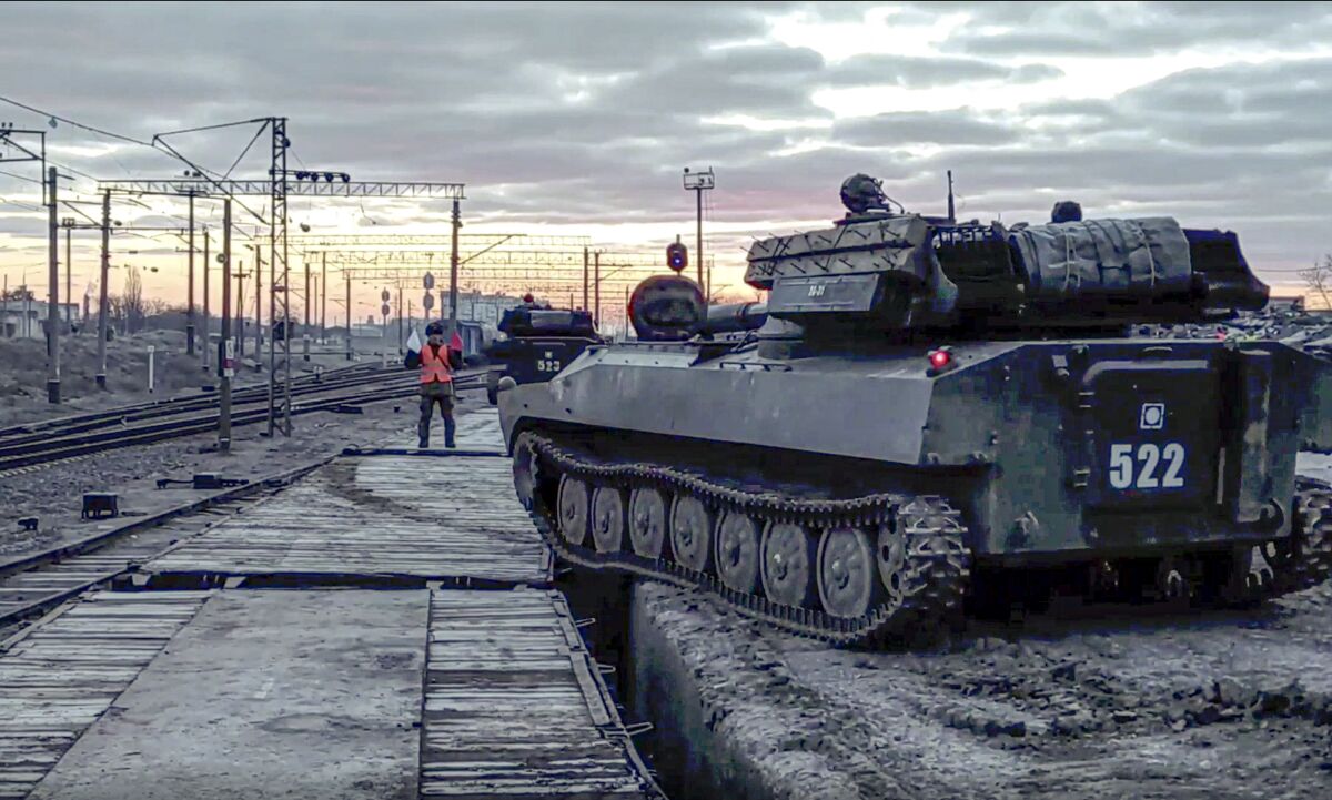 An armored vehicle near a railway platform 
