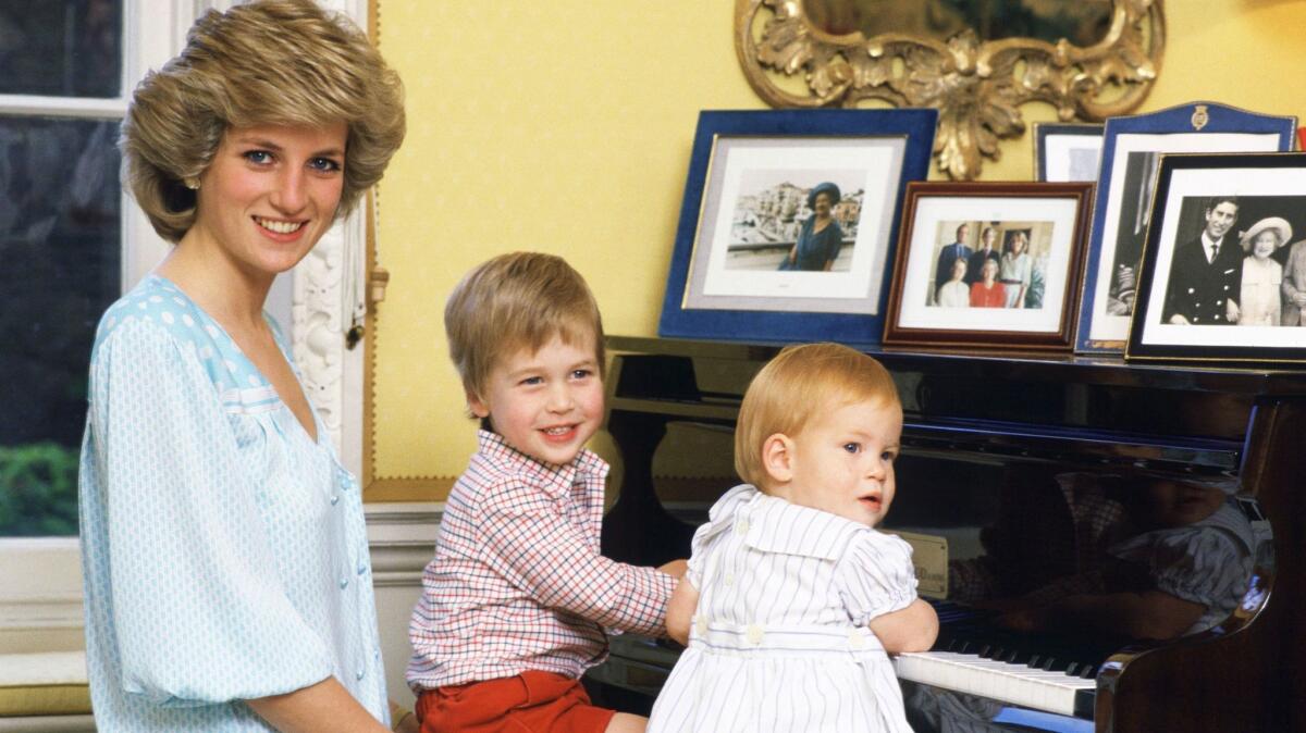 Diana, Princess of Wales with her sons, Prince William and Prince Harry, at the piano in Kensington Palace in the 1980s.